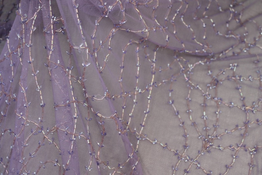 Lilac tulle with clear lilac bugle beads in a barbed wire/leaf pattern fabric