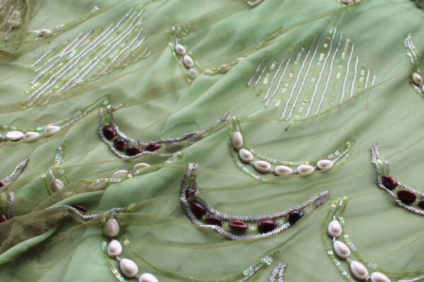 Green Tulle with Beads, Sequins and White and Brown Shells fabric