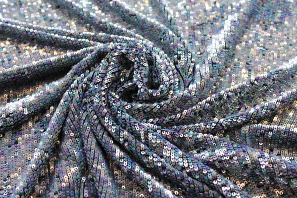 Overlapping Micro Sequin On Silk Chiffon - Clear Iridescent on Black fabric