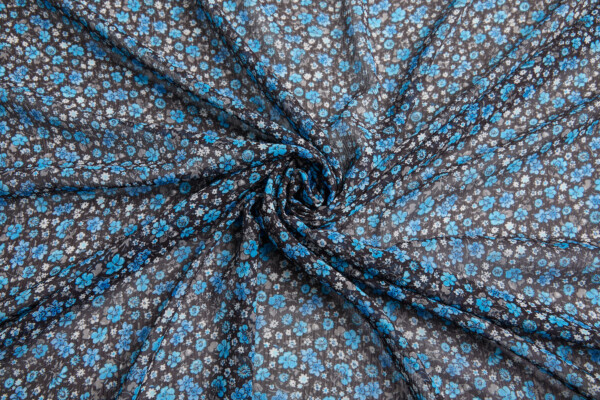 Floral Printed Chiffon - Turquoise on Brown fabric