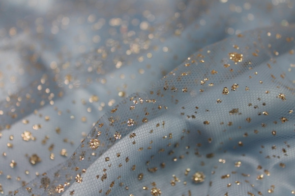 Glitter Spray Tulle - Gold on Pale Blue fabric