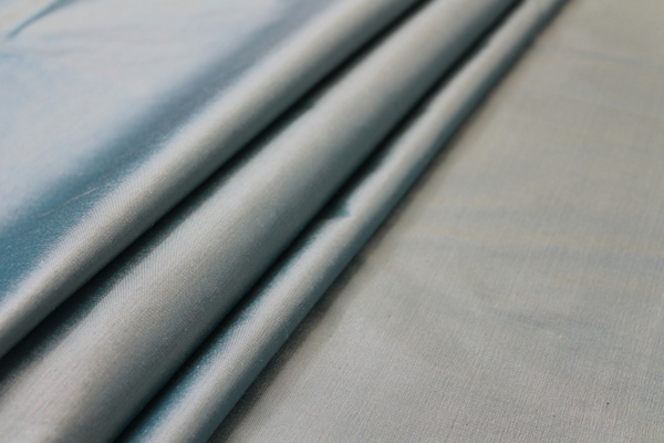 Silk Dupion - Teal shot Cream fabric
