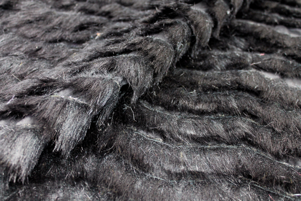Cut Faux Fur Strips on Habotai - Black on Black fabric