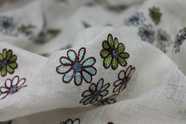 Ivory Sheer Linen with Floral Embroidery in Blue Green and Brown fabric