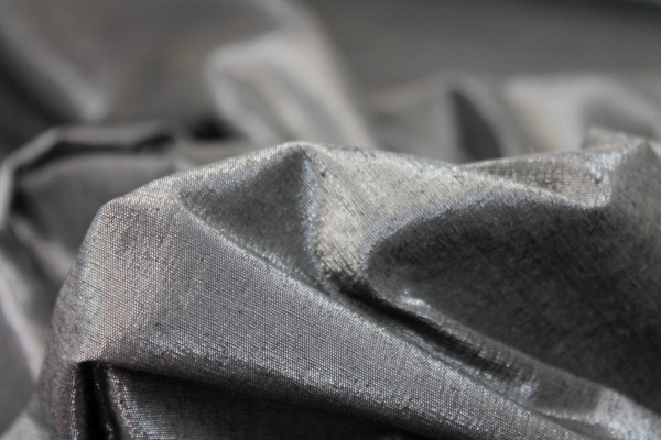 Metallic Silk Noil - Black shot Clear fabric