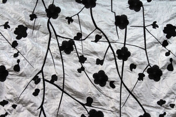 Black Floral Embroidery on Silver shot Ivory Metallic Dupion fabric