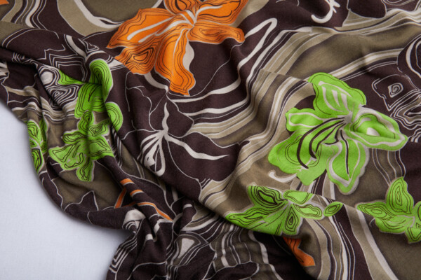 Italian Large Lilies Printed Jersey in Browns, Oranges and Greens fabric