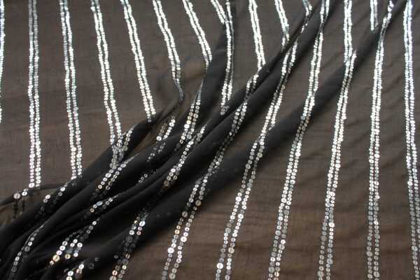 Black chiffon with silver sequins in lines fabric