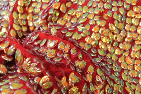 Dragon Scale Sequin in Iridescent Red On Silk Chiffon fabric