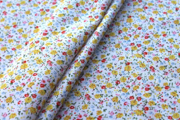 Printed Cotton Lawn - Yellow, Orange and Pale Blue on Off White fabric