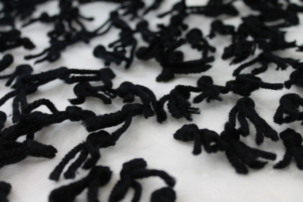 Yarn Tassels on Silk Organza - Black on Ivory fabric