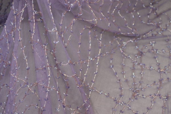 Lilac tulle with clear lilac bugle beads in a barbed wire/leaf pattern fabric