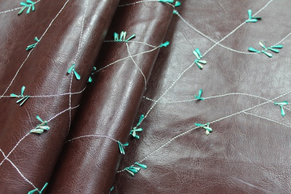 Embellished Leatherette - Brown with Teal Metal Sequins fabric