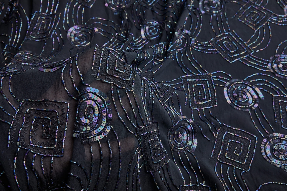Black iridescent sequins and beads on chiffon